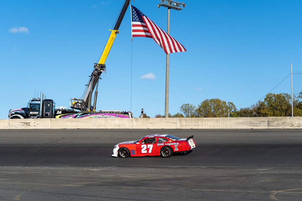 Brothers Brothers Racing Super Cup Stock Car Seires car on track in front of American flag